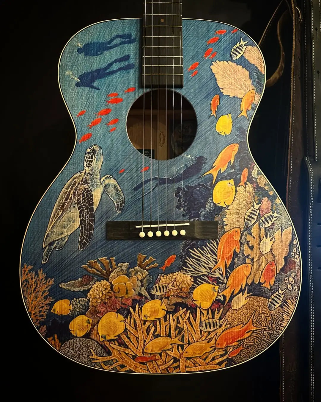 The_Martin_OM_Biosphere_-_in_stock_now_It_s_not_just_a_guitar._It_s_a_call_to_action_on_climate_change._Artwork_by_Robert_Goetzl._martinguitar-1.webp